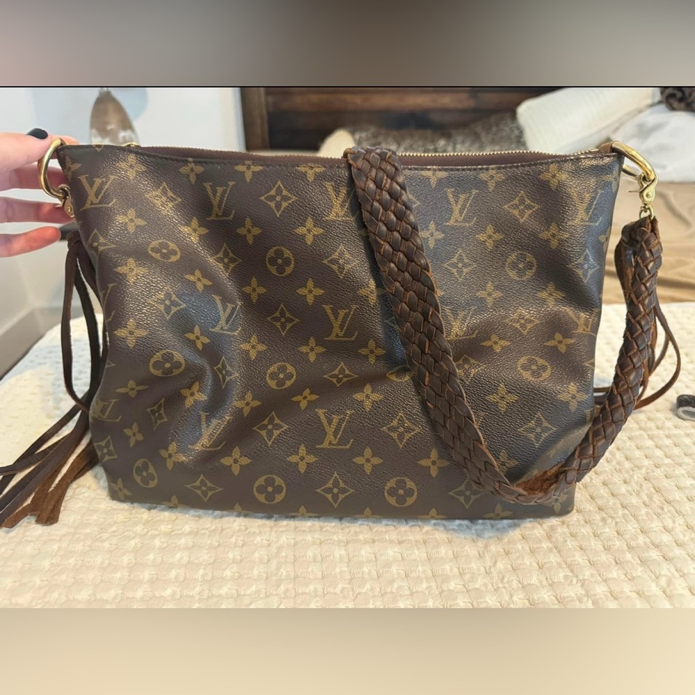 Sully Handbag Monogram Canvas PM with a braided leather strap